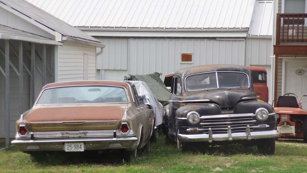 A Chrysler New Yorker and a Plymouth were slumbering in the yard.  Without current plates, they wouldn’t get far. They knew being hidden was not a factor, especially with the [&hellip;]