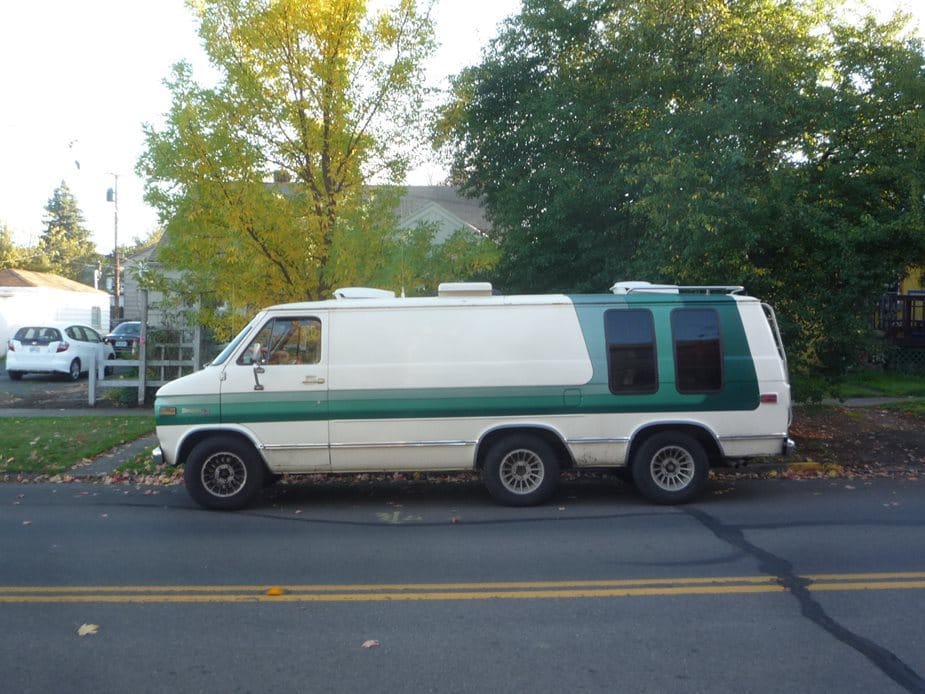 Curbside Find: 1980s Chevrolet Triple-Axle Van 1 1980s Chevy Wagon with a triple axle, parked by the curbside.