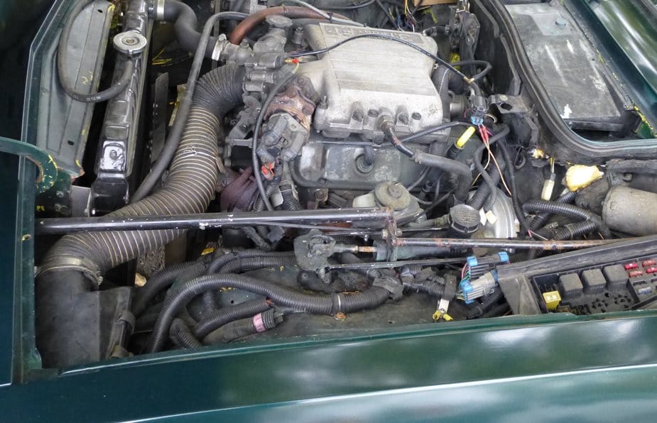Yes it is, but is it in a familiar setting? Hint: in a “familiar” sort of way, it is. The Triumph Herald was identified by nlpnt. Well done!