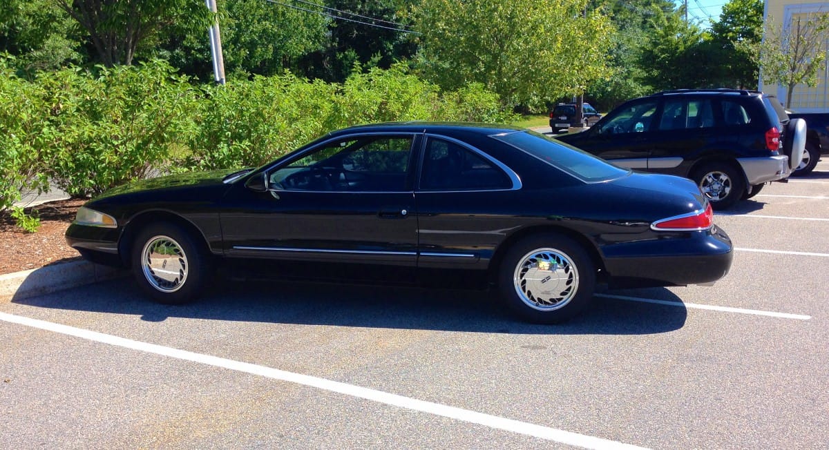 I was coming out of work the other day when I noticed this brilliant black-on-black Lincoln Mark VIII, glistening in the hot summer sun. Given the car’s pristine condition, Lord [&hellip;]
