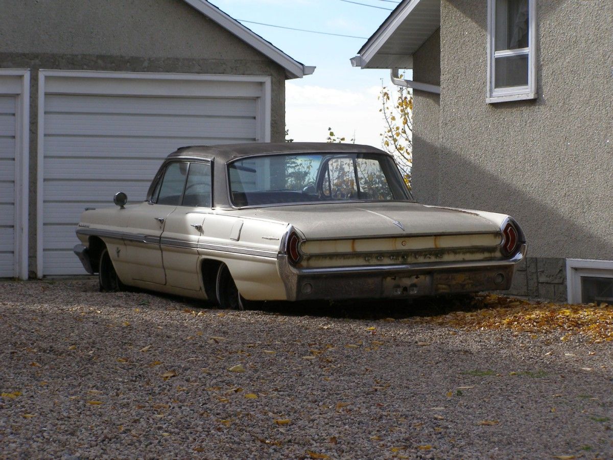 (submitted by Garry Melnyk)       I have been driving by a house on the way to my mother’s senior’s residence for two plus years now. The 1962 Pontiac Parisienne in the [&hellip;]