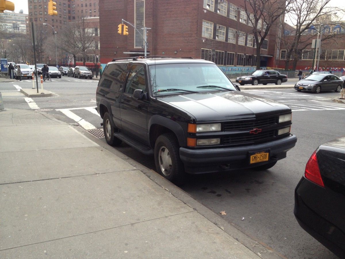 Either this Chevrolet Tahoe Sport and GMC Yukon GT are owned by neighbors with similar taste in trucks, or there is a lone two-door GMT-400 enthusiast living in Chelsea.