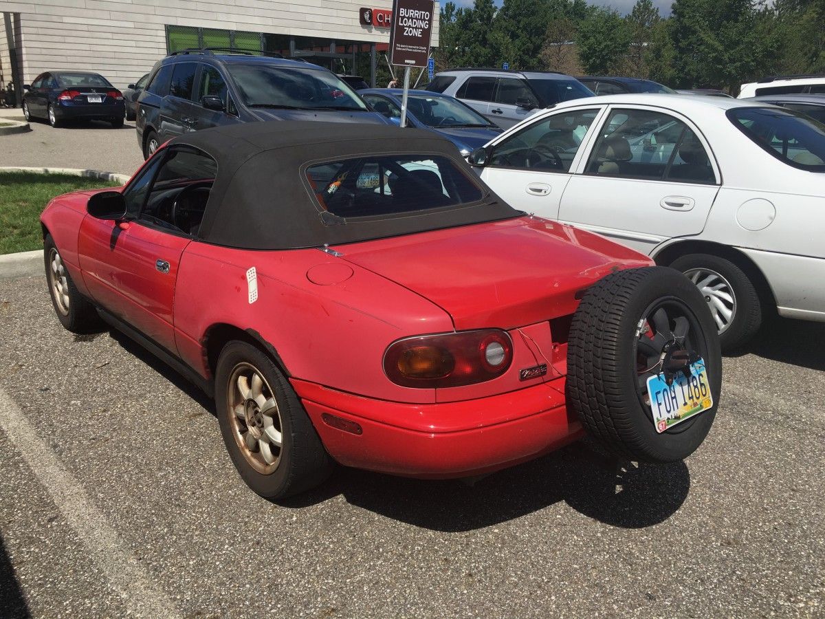CC Capsule: Mazda Miata with a Continental Kit OK, I’ve not seen this one before. Judging by the roll cage and shaved tires, this person clearly uses their Miata for actual autocrossing events.