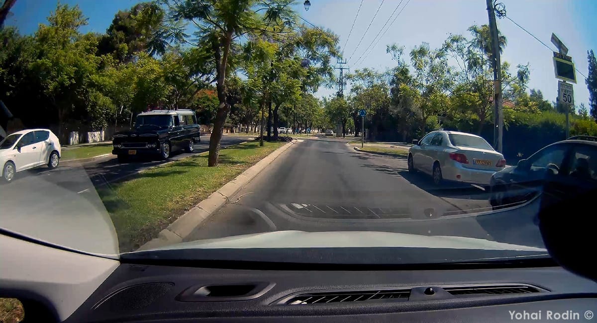Driving with my wife and son to a relative’s Bar Mitzvah event (oh God…), I spotted- only just- a big, dark, familiar shape coming towards me in the opposite lane.