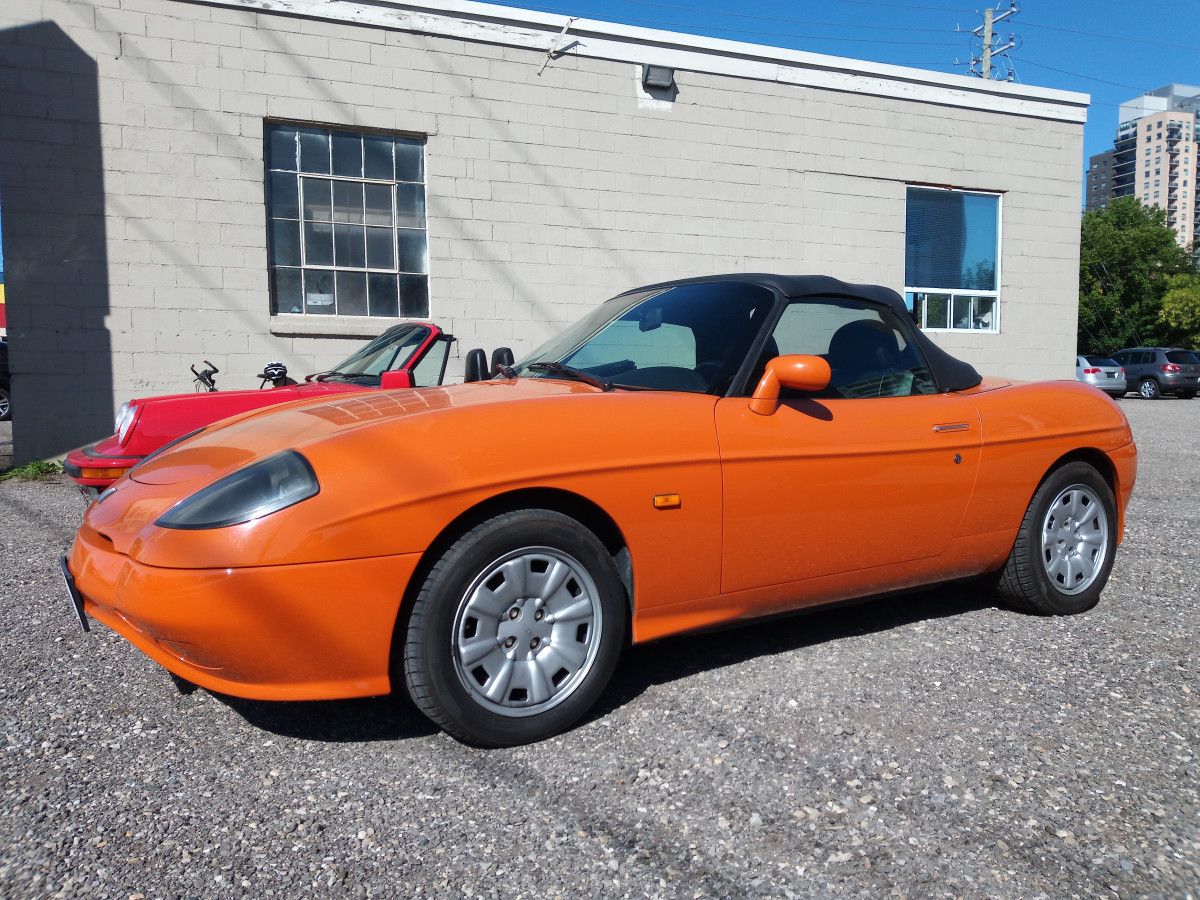 I found this 1998 Fiat Barchetta (= little boat) for sale on a small lot in Waterloo, Ontario. The Barchetta was produced from 1995-2005, with a 2 year hiatus from [&hellip;]