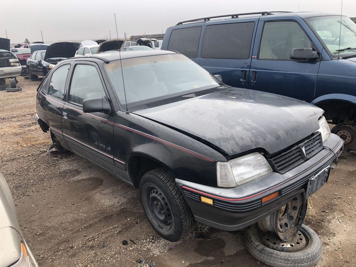 Junkyard Classic: 1989 Pontiac LeMans LE – K-Po(o)p Kadett 12 Photo of a black junkyard 1989 Pontiac LeMans