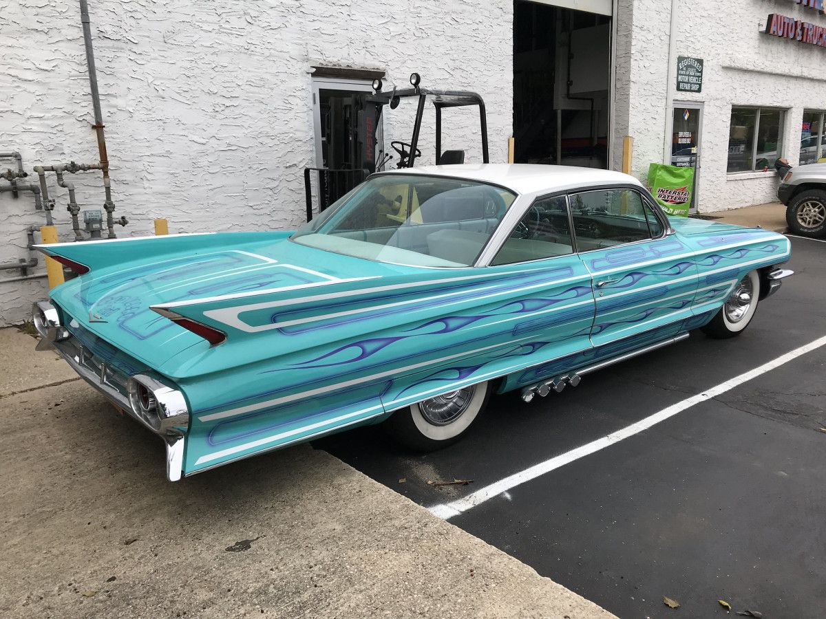 Cohort Pic(k) of the Day: 1961 Cadillac Coupe – With a Few Enhancements posted at the Cohort by William Rubano