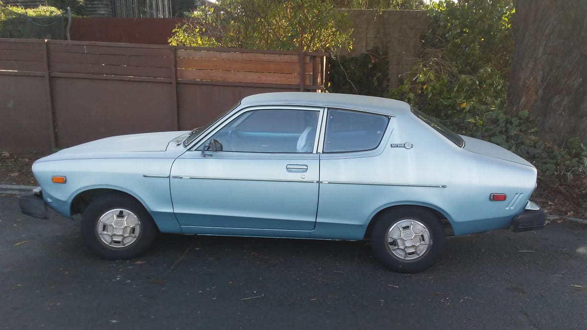 It’s a Datsun B210 (Nissan Sunny in other markets).  At the local supermarket.  Parked out of the way, in the shade, presumably to forestall any further decay.  Still, it’s out [&hellip;]