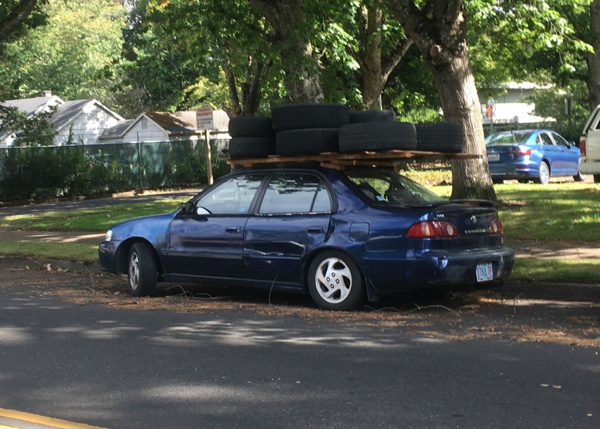 Curbside Wordless Outtake: Corolla With Many Spares CC 427 003