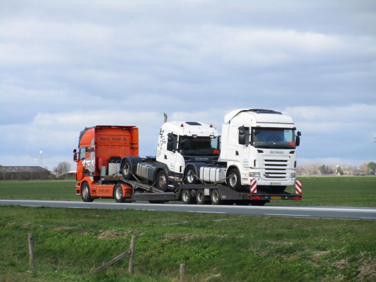 This last round of my harmless, late March walk-by shooting starts with a trio of Scania R-series 4×2 tractors. The one at work is a 2008 R500 V8, towing a [&hellip;]