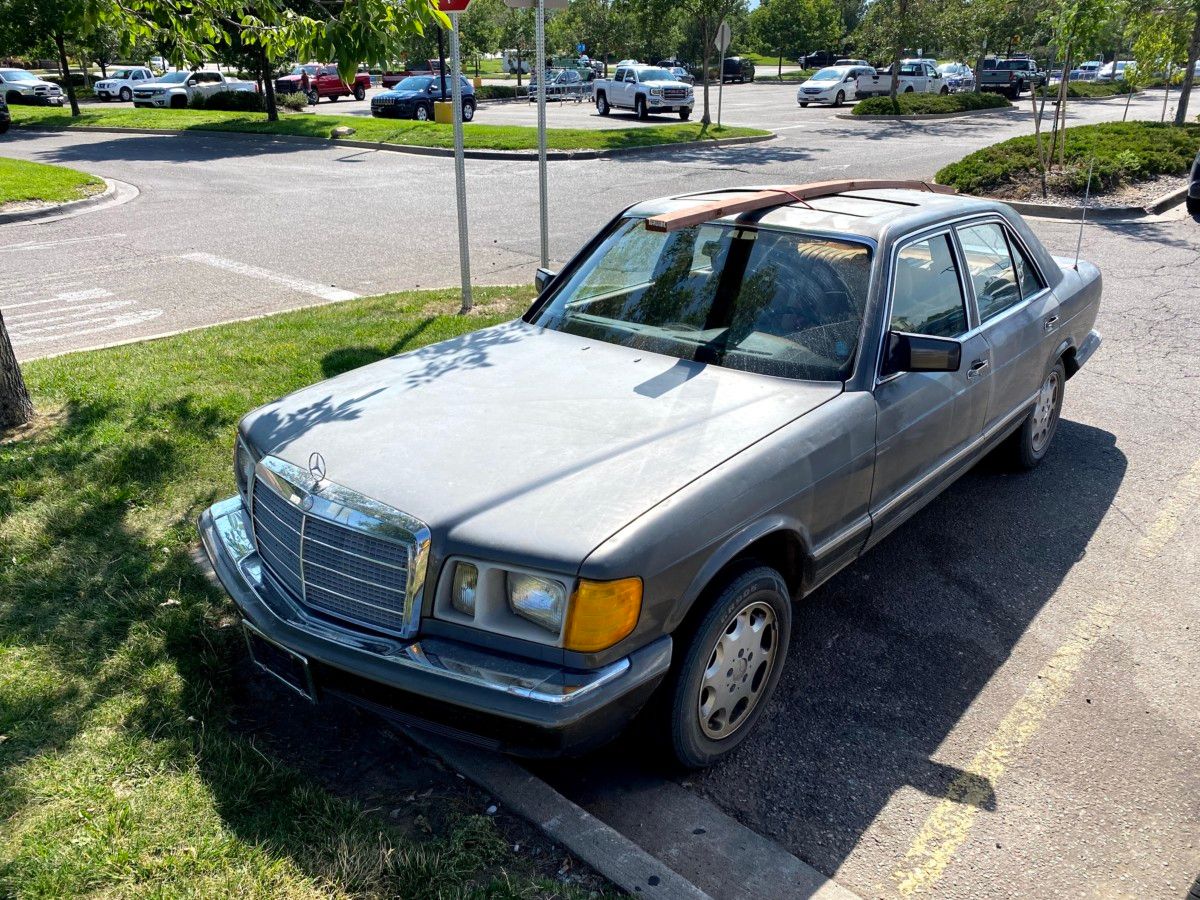 Curbside Outtake: Who Needs A Stinkin’ F-250 King Ranch PowerStroke Diesel To Transport Lumber? That’s a fine piece of pressure treated lumber securely strapped to this Mercedes S Class. So secure it’s actually bowing.