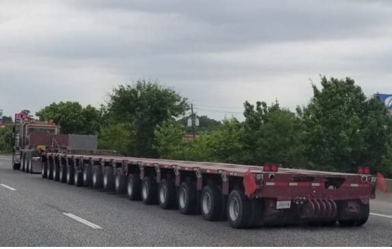 This hardly needs any text. I count 16 axles on the trailer, each with 4 wheels, giving it 64 wheels. But wait, there’s more. It looks to me like there [&hellip;]
