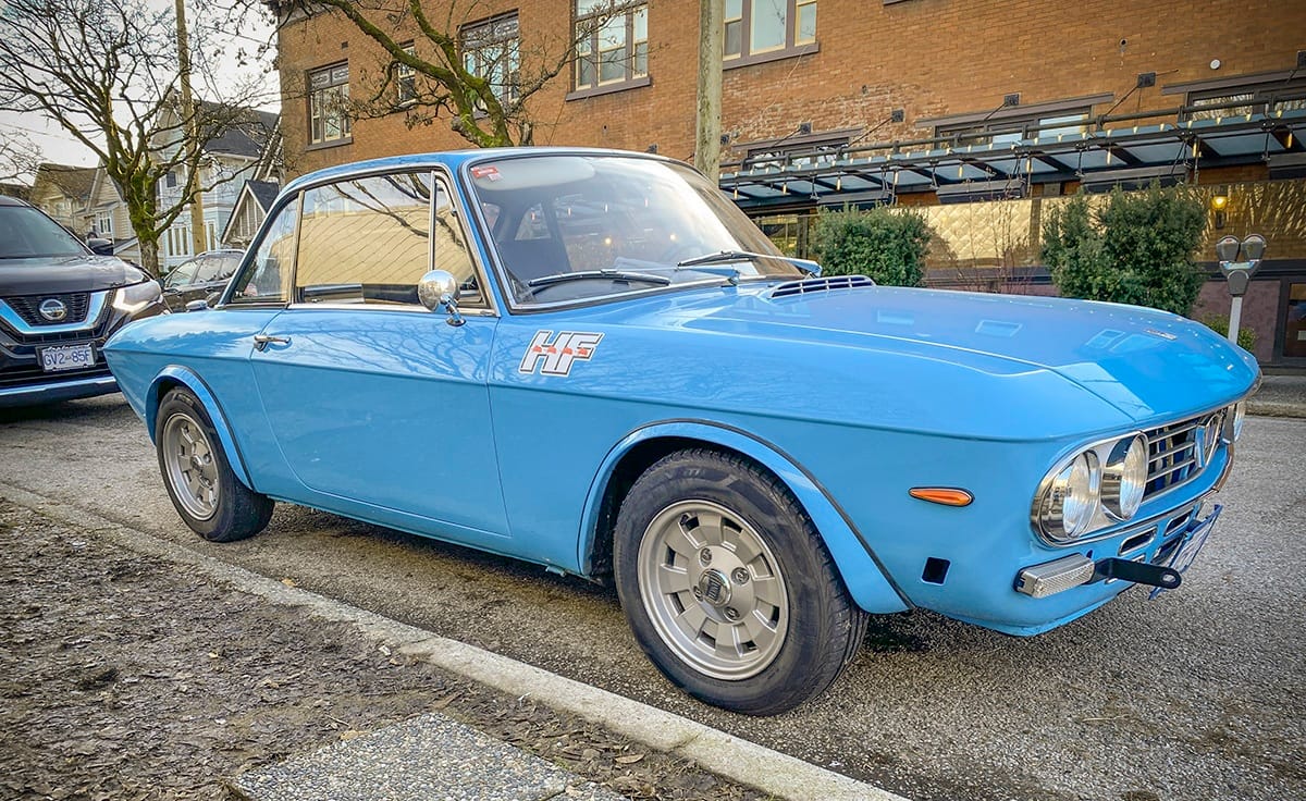 To the best of my research, this fine little blue car gives every appearance of being a 1972 Lancia Fulvia 1600 HF.