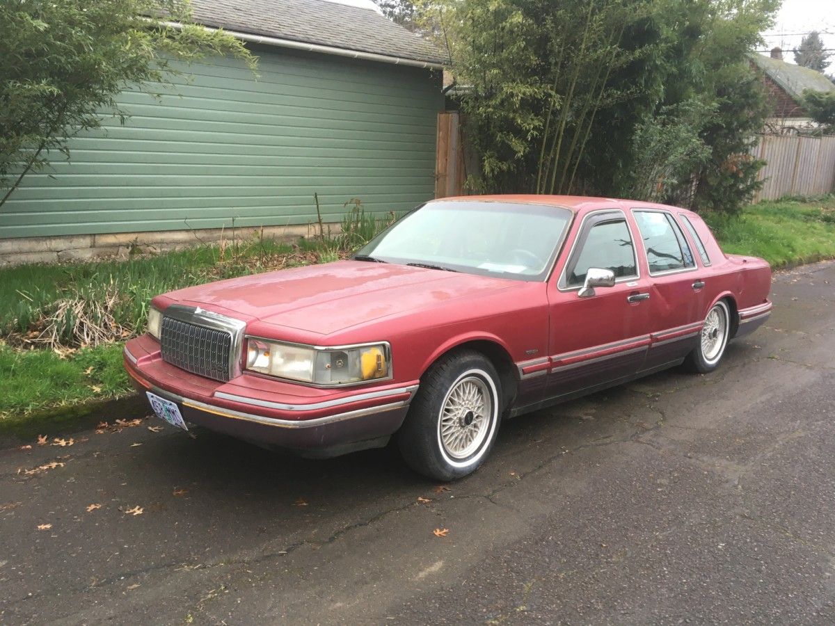 This car has been a fixture in my neighborhood for quite some years. It’s located on the same block as a cluster of my rentals, so I’ve been going by [&hellip;]