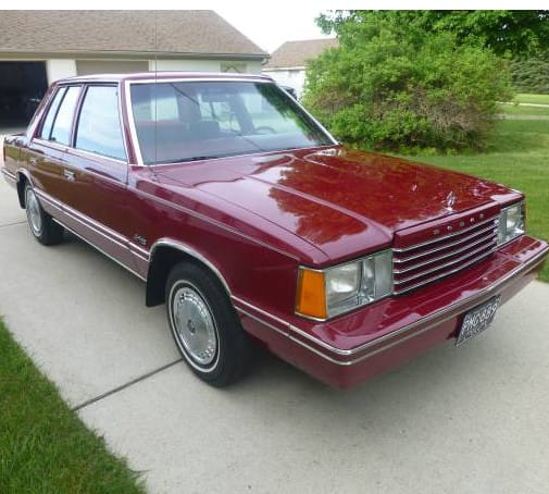 (first posted 4/5/2016)     How long since you saw a first-generation K-car? In one piece, I mean? The facelifted ’85-’89 versions are still seen every odd and then, but the ’81-’84 [&hellip;]