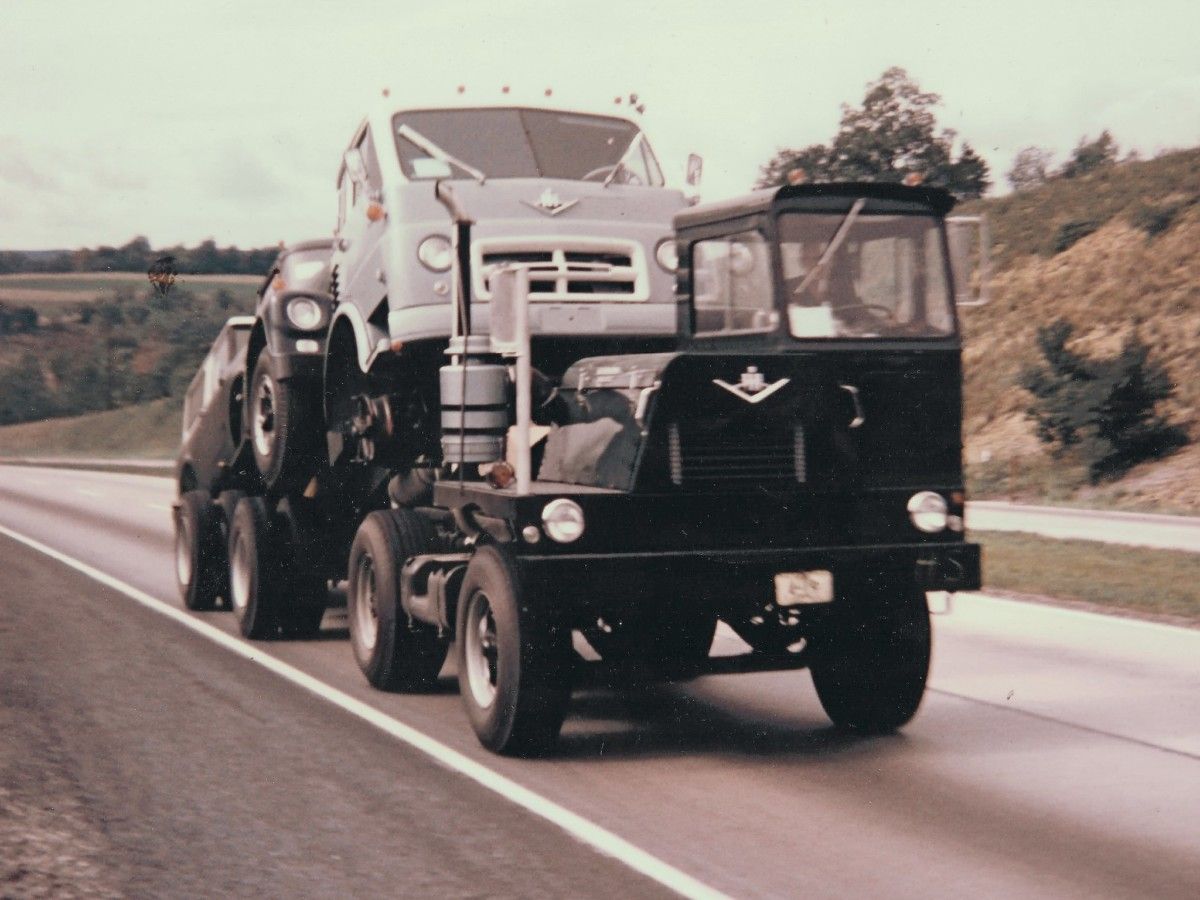 This shot is doubly fascinating. Not only is the lead truck a rare International M-42-CAE yard jockey, but I see it’s got super single tires on the back. Which makes [&hellip;]