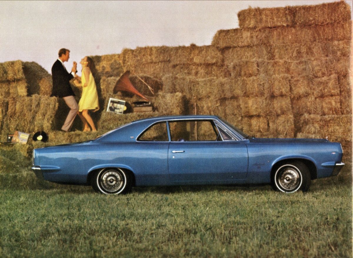 The images in some of these old brochures are just delightfully perplexing: The nicely attired couple, the haystacks, the LP records, a phonograph? And the not-quite-Mustang-hip Ambassador Sports Sedan? What [&hellip;]