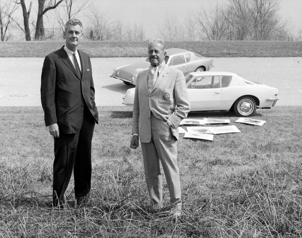 1964 Studebaker GT Hawk: One Of Only 70 Final-Year Hawks With The R2 Supercharged Engine 26 B&W press photo of Sherwood Egbert and Raymond Loewy with two Studebaker Avanti coupes in the background 1962