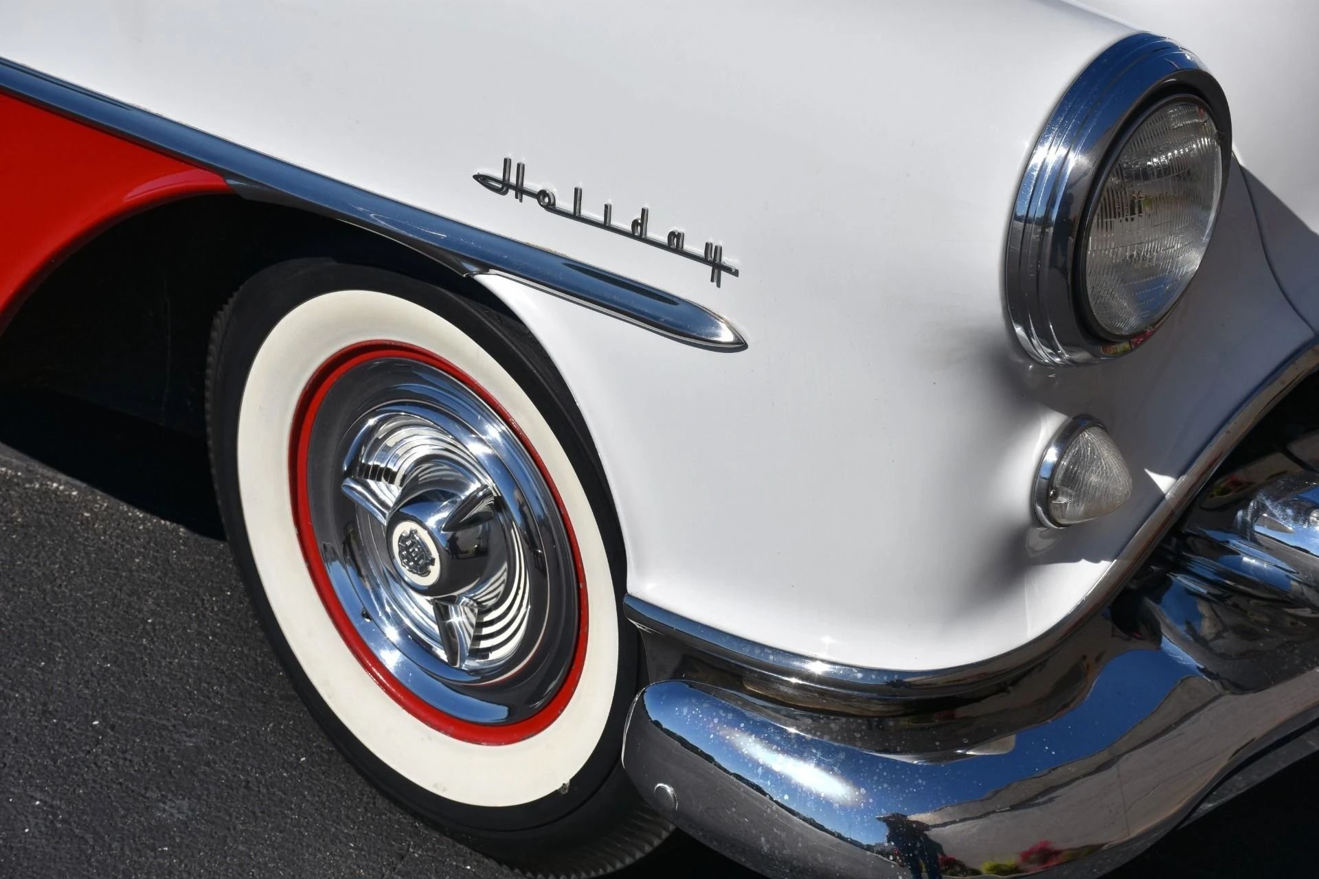 Automotive History: 1949–1970 Oldsmobile Holiday Hardtop – A Holiday In Lansing (With Apologies To Irving Berlin) 1 Holiday badge on the fender of a Polar White and Flare Red 1954 Oldsmobile 98