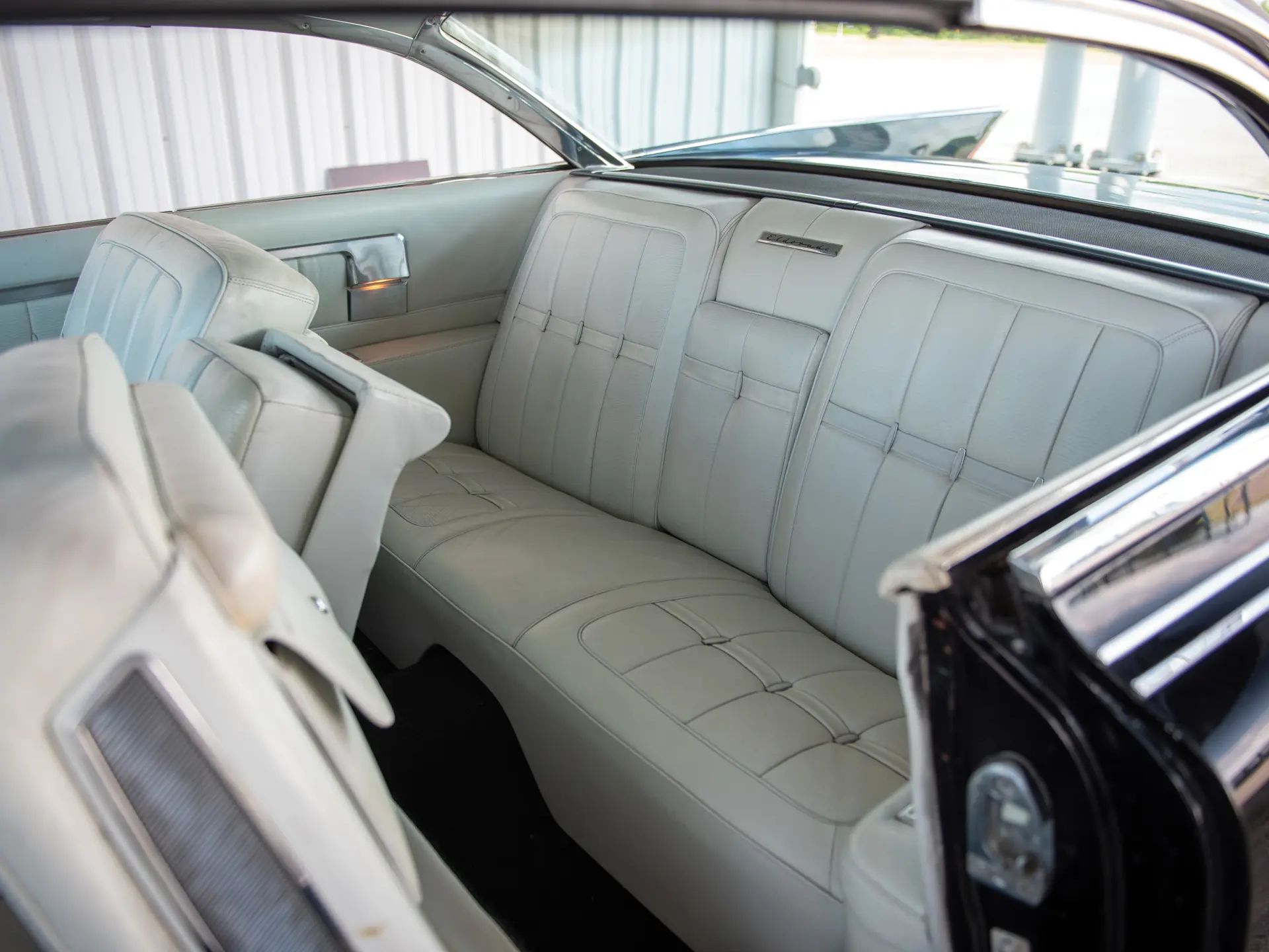 1960 Cadillac Eldorado Seville: An Artifact Of The Tomorrow That Never Was 18 Back seat of a 1960 Cadillac Eldorado Seville with white leather upholstery, viewed through the driver's door