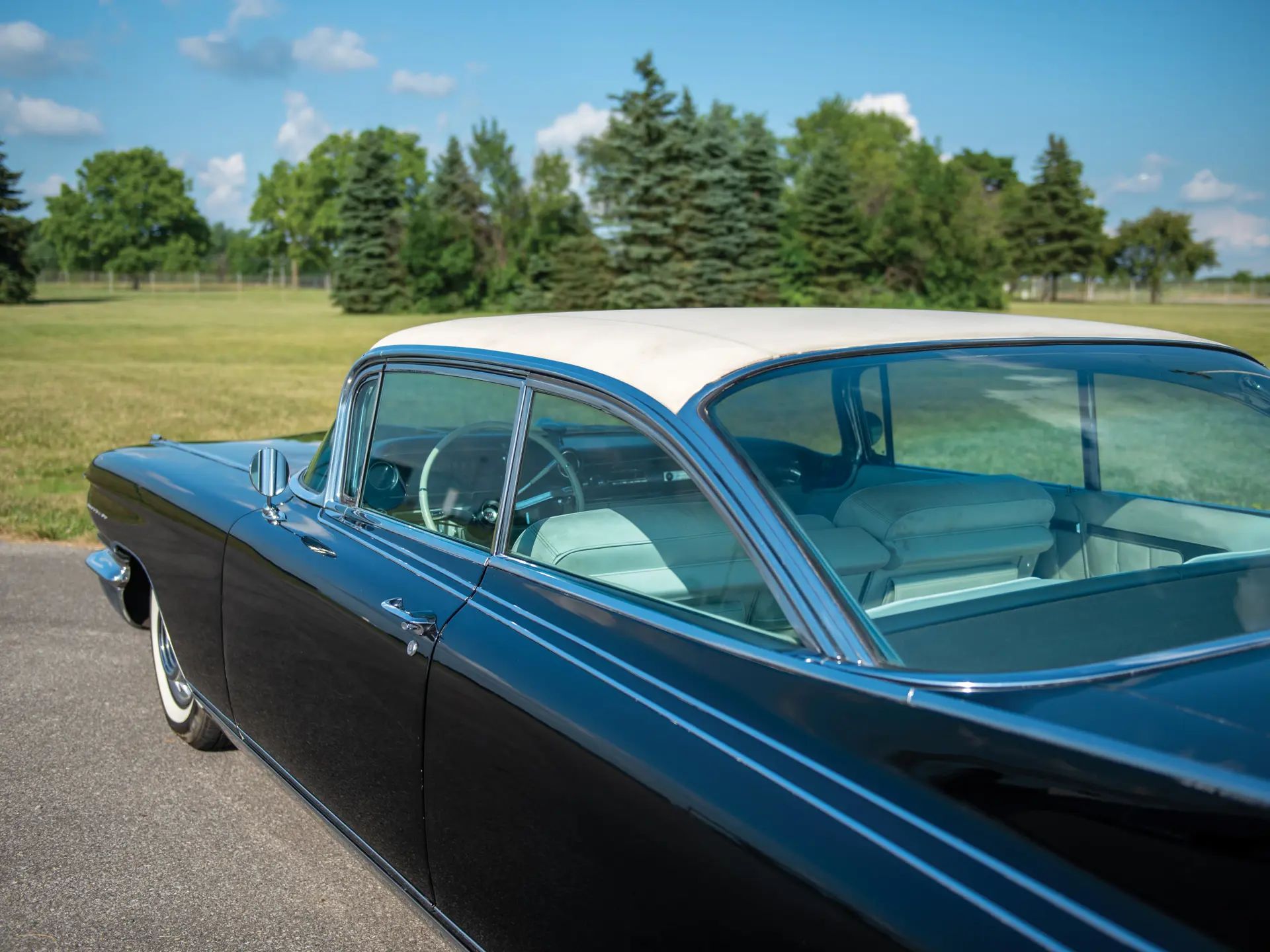 1960 Cadillac Eldorado Seville: An Artifact Of The Tomorrow That Never Was 16 Rear view of the roof of a black 1960 Cadillac Eldorado Seville with a white vinyl top