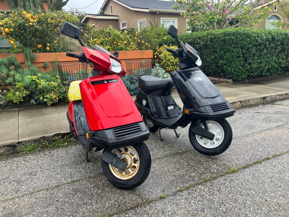 Curbside Finds – A Variety Of Shapes, Sizes And Colors On The Streets Of Santa Cruz 1 Two Honda Elite scooters, one red, one black