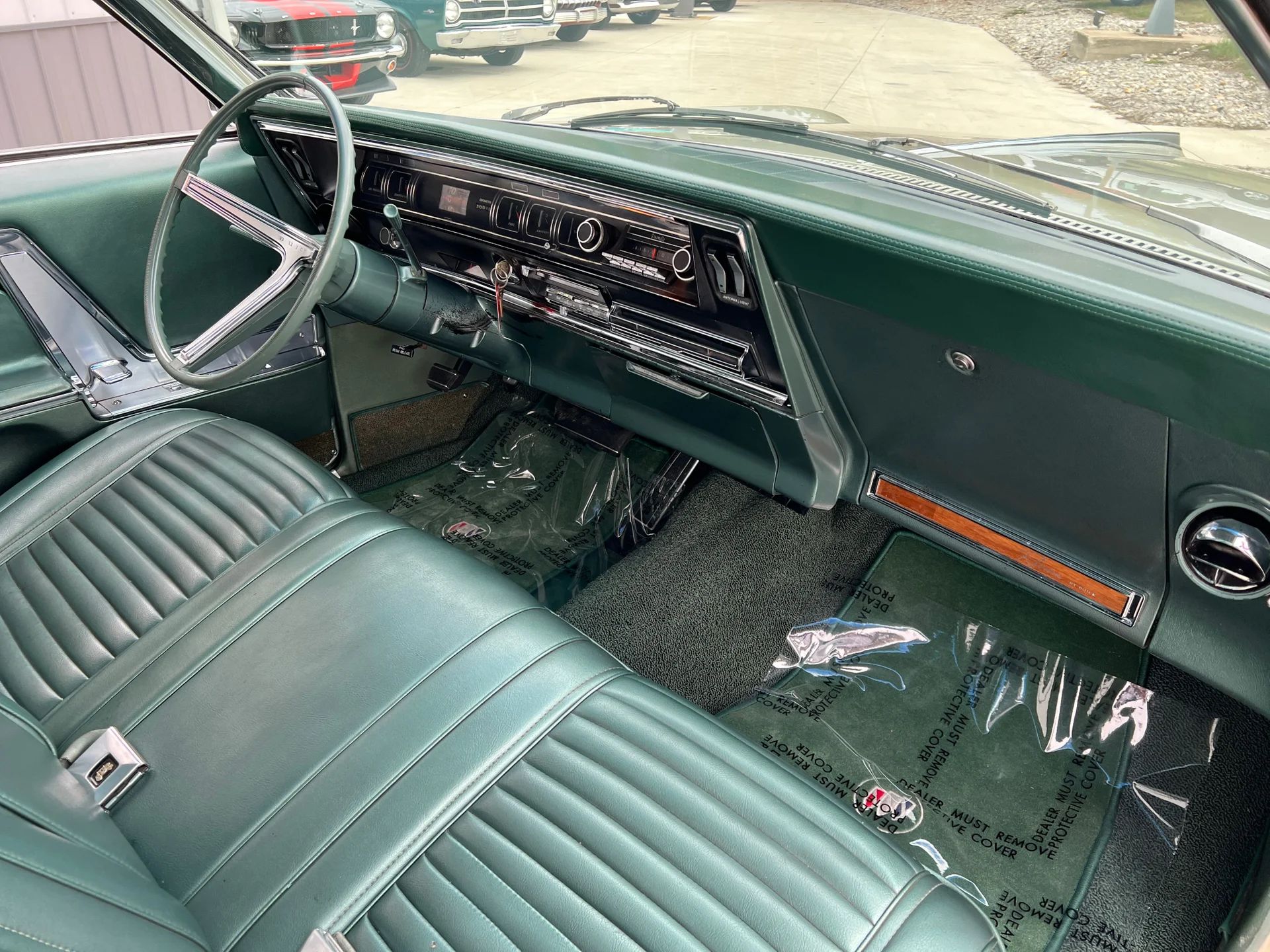 1966 Buick Riviera Versus 1966 Oldsmobile Toronado – Closely Related, Yet So Different (Part 2) 24 Right side of the dashboard of a 1966 Buick Riviera with green vinyl Custom Trim and Strato Bench seat