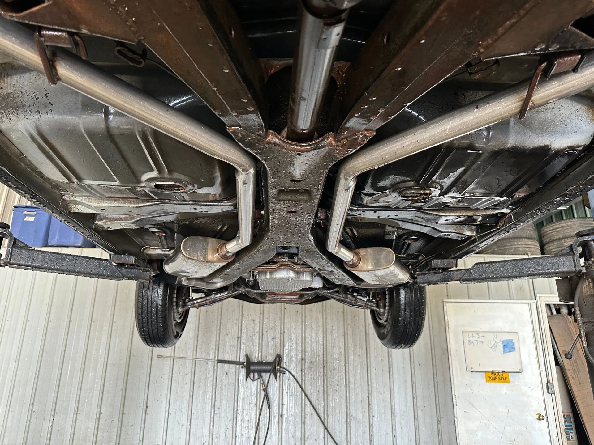 1966 Buick Riviera Versus 1966 Oldsmobile Toronado – Closely Related, Yet So Different (Part 1) 17 Underside and frame of a Silver Green 1966 Buick Riviera, seen from underneath with the car on a hoist