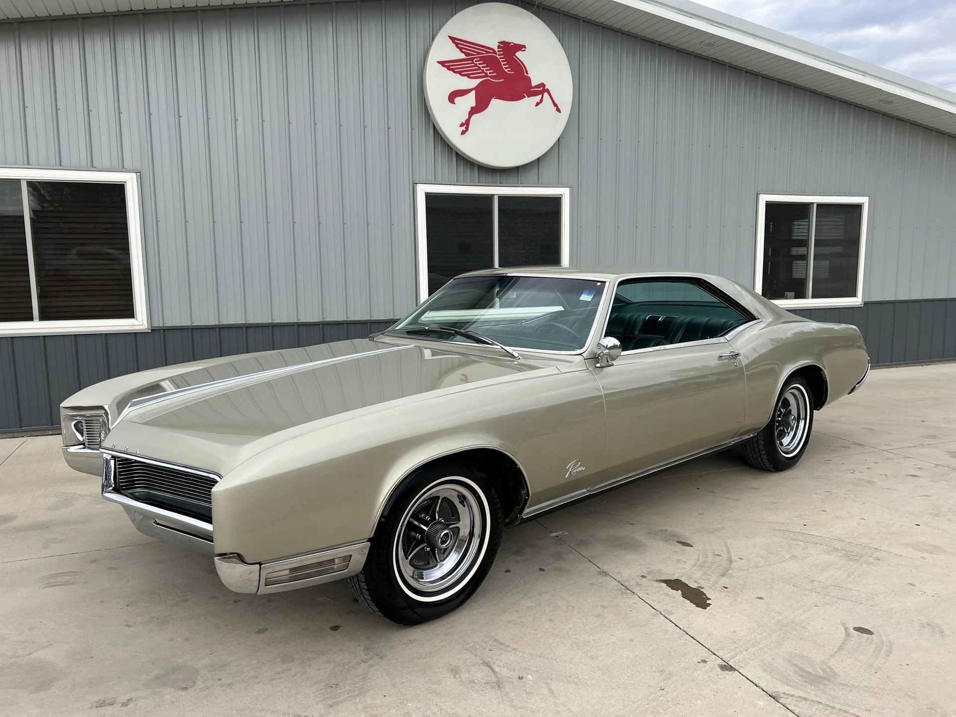 1966 Buick Riviera Versus 1966 Oldsmobile Toronado – Closely Related, Yet So Different (Part 2) 3 Left front 3q view of a Silver Green 1966 Buick Riviera with styled steel wheels