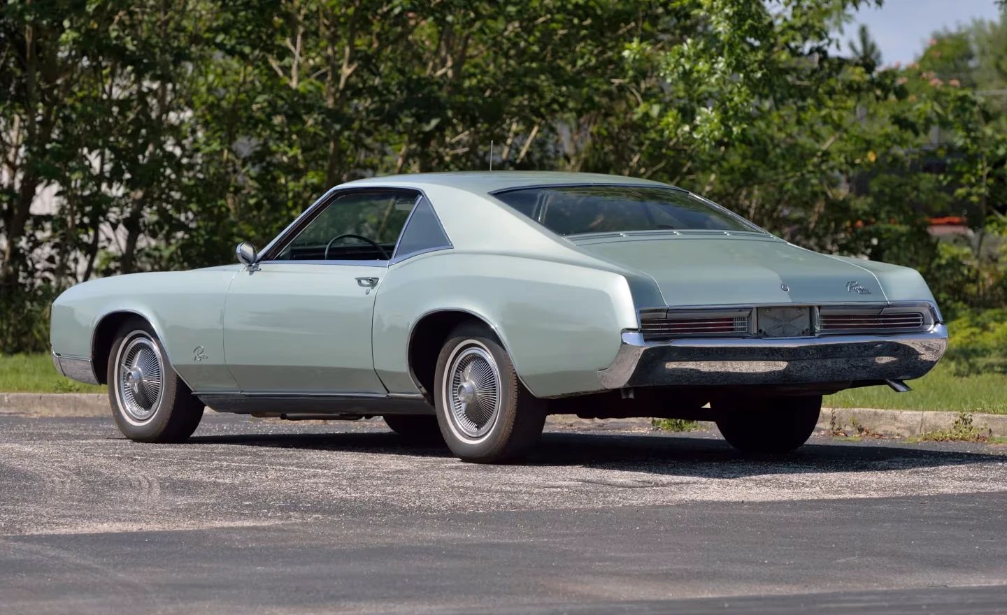 1966 Buick Riviera Versus 1966 Oldsmobile Toronado – Closely Related, Yet So Different (Part 1) 13 Left rear 3q view of a Silver Green Buick Riviera with wire wheel covers