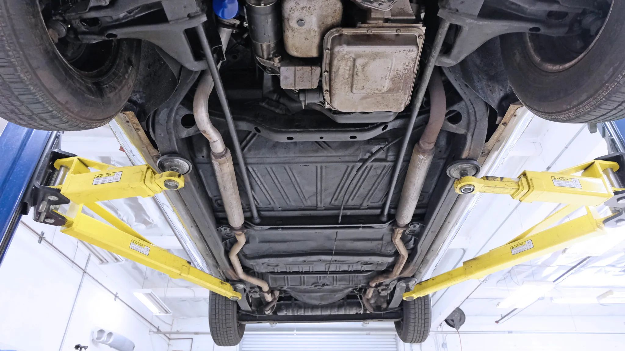 1966 Buick Riviera Versus 1966 Oldsmobile Toronado – Closely Related, Yet So Different (Part 1) 16 Underside of an Almond Beige 1966 Oldsmobile Toronado, seen from beneath with the car on a hoist