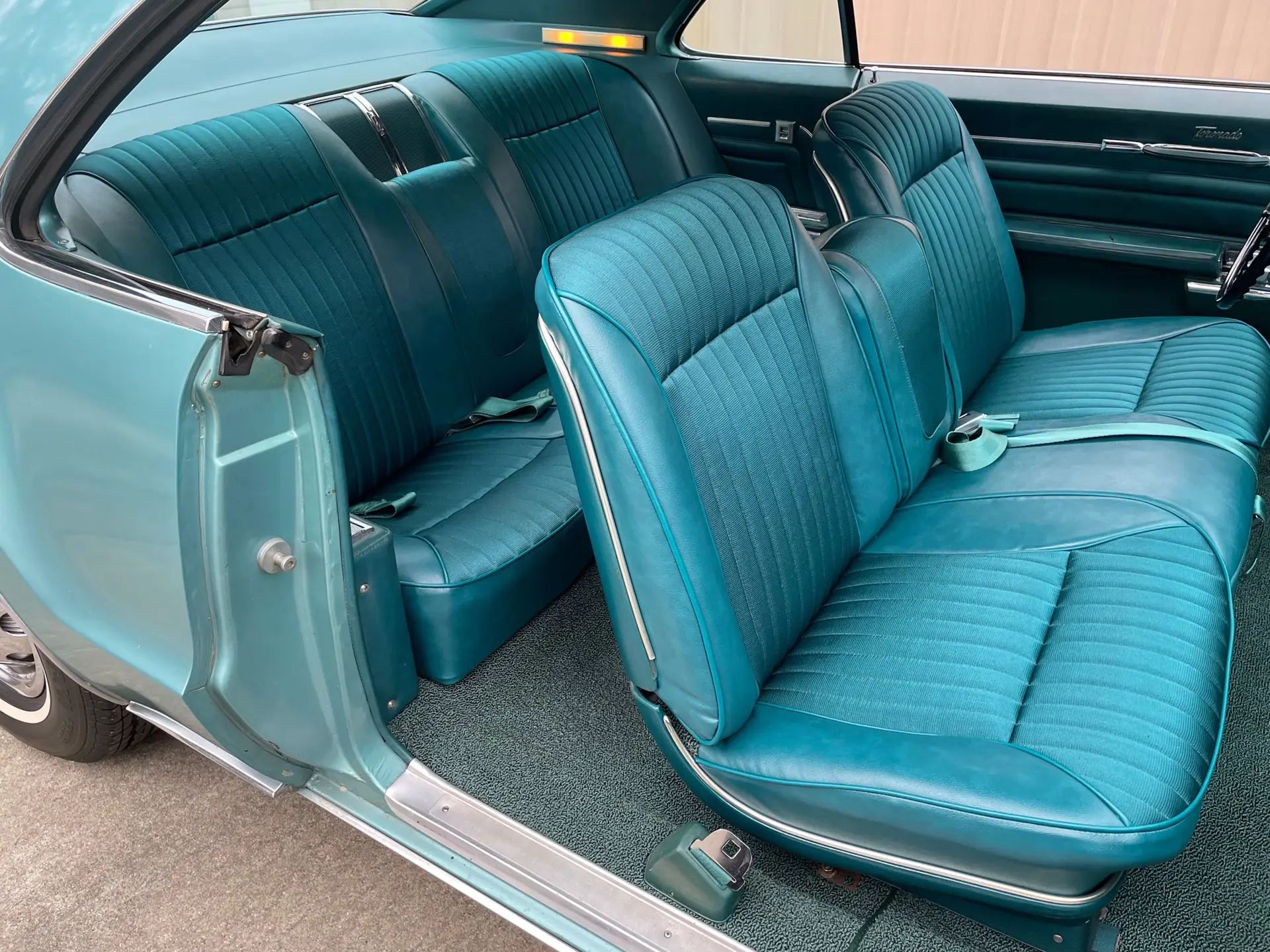 1966 Buick Riviera Versus 1966 Oldsmobile Toronado – Closely Related, Yet So Different (Part 2) 7 Strato Bucket seat of a 1966 Oldsmobile Toronado Deluxe, viewed through the passenger door