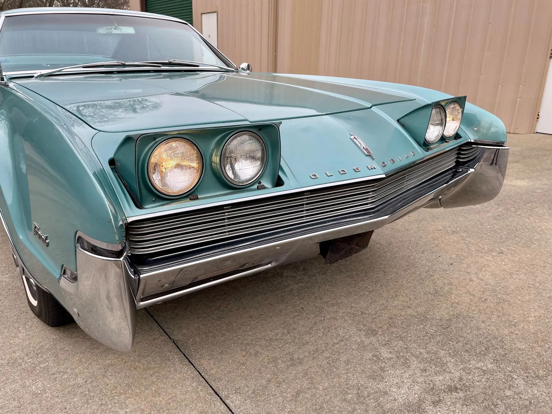 1966 Buick Riviera Versus 1966 Oldsmobile Toronado – Closely Related, Yet So Different (Part 1) 10 Front end of an Ocean Mist 1966 Oldsmobile Toronado Deluxe with its headlights on
