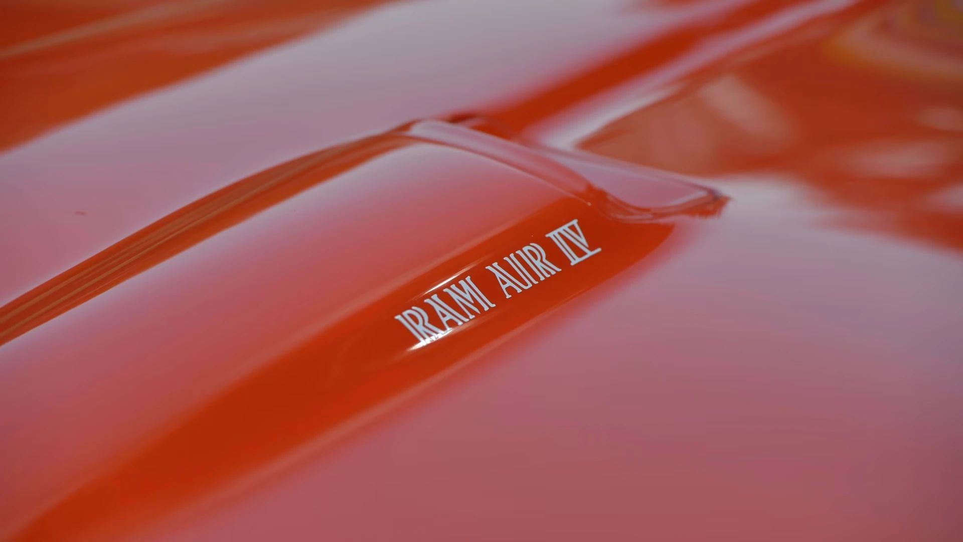 Ram Air callouts on the hood of a Carousel Red 1969 Pontiac GTO Judge
