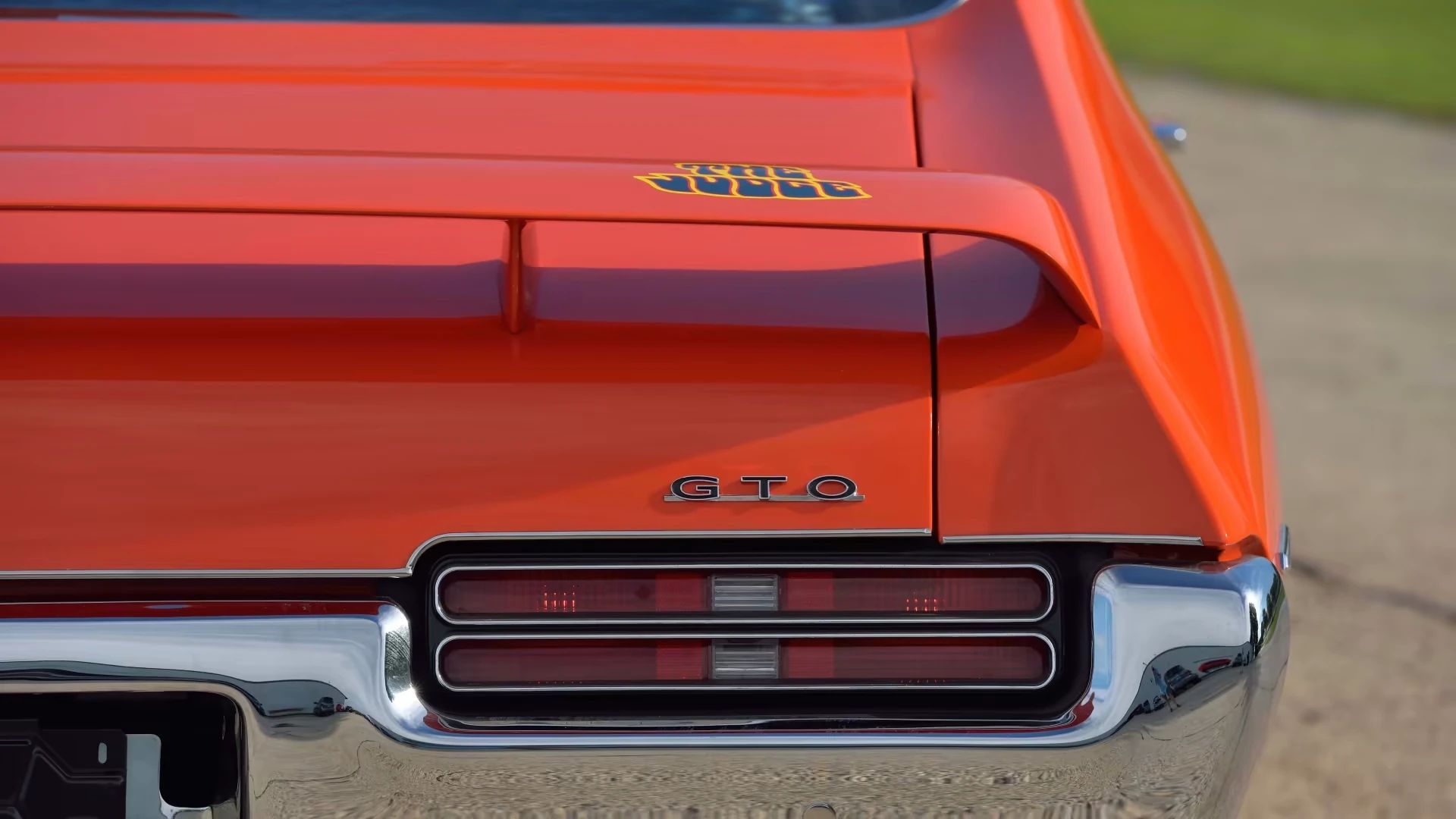 Rear decklid spoiler and GTO badge on a Carousel Red 1969 Pontiac GTO Judge