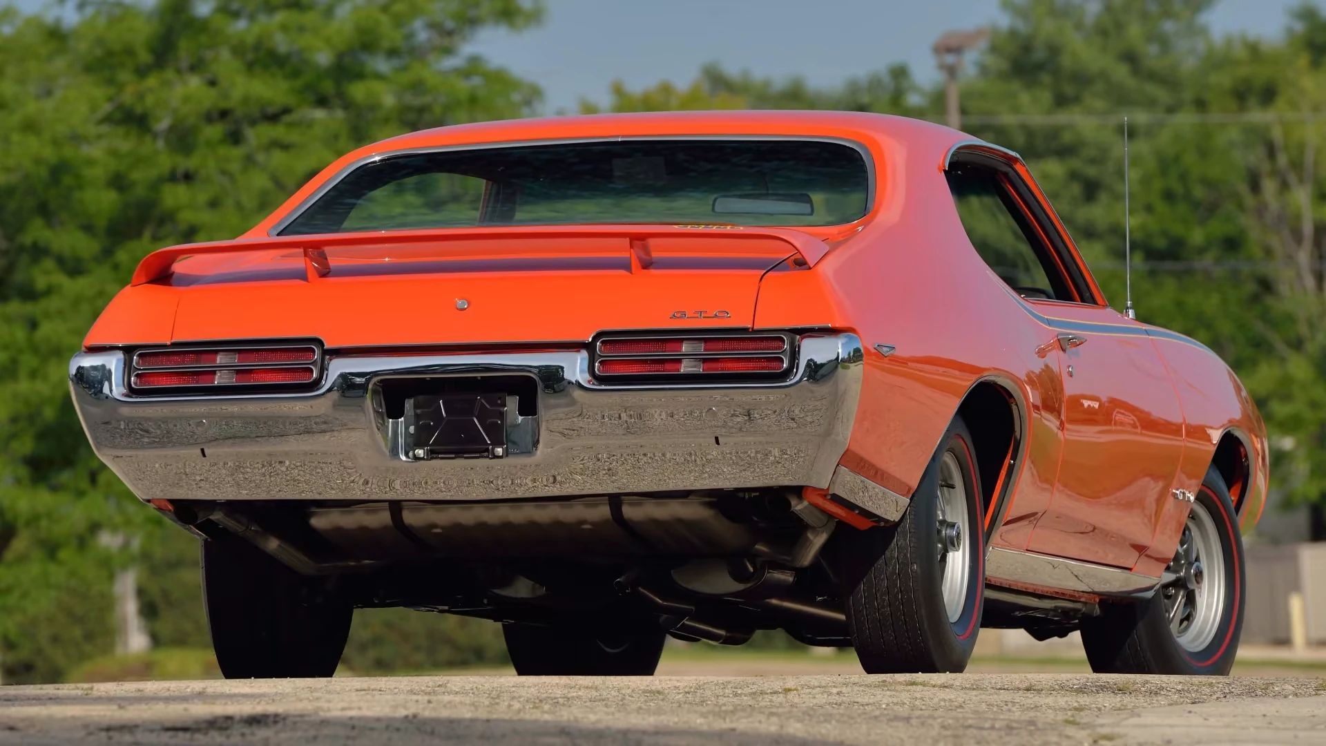 Rear view of a Carousel Red 1969 Pontiac GTO Judge hardtop