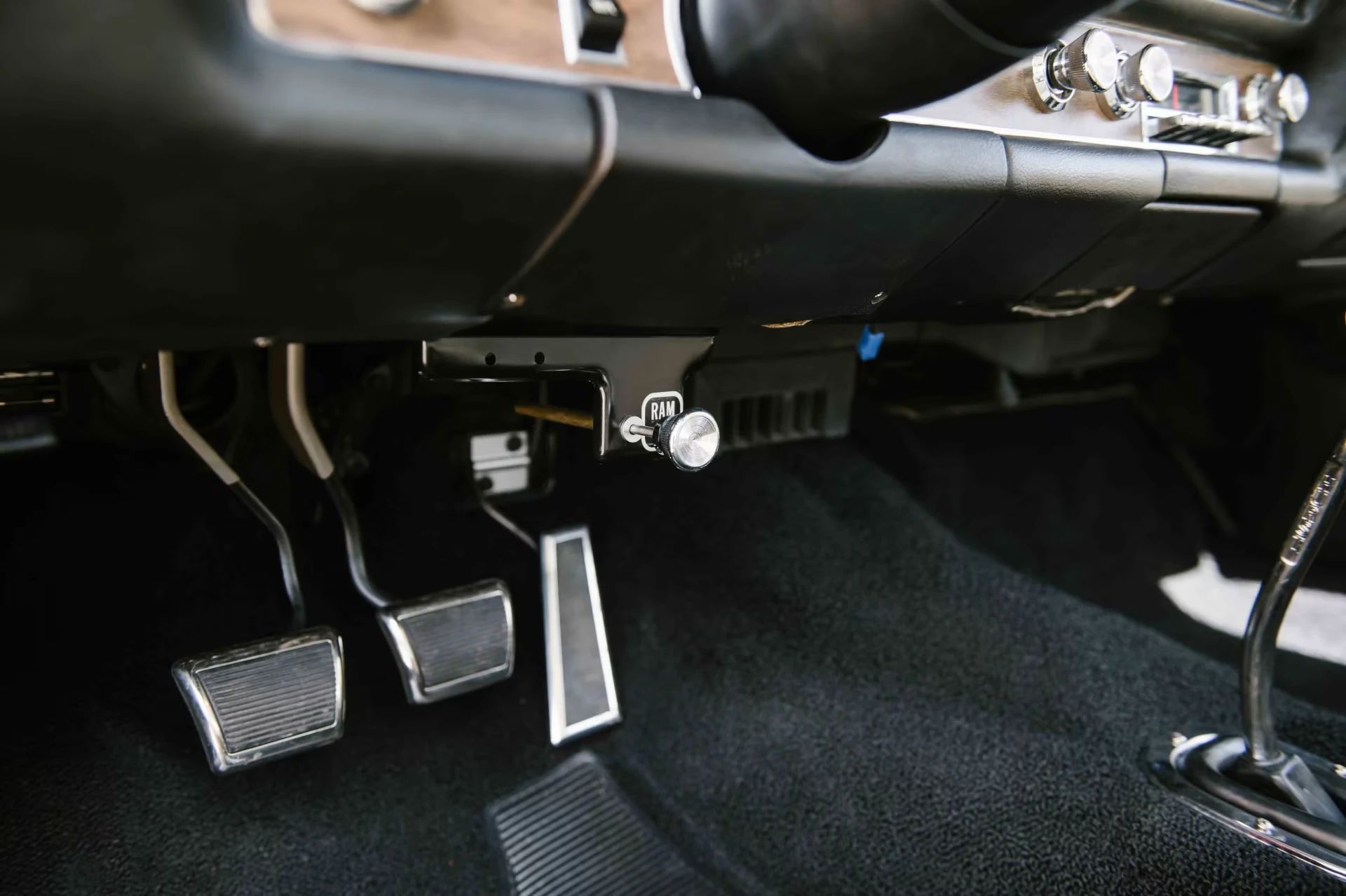 Ram Air control knob under the dash of a 1969 Pontiac GTO Judge with black interior