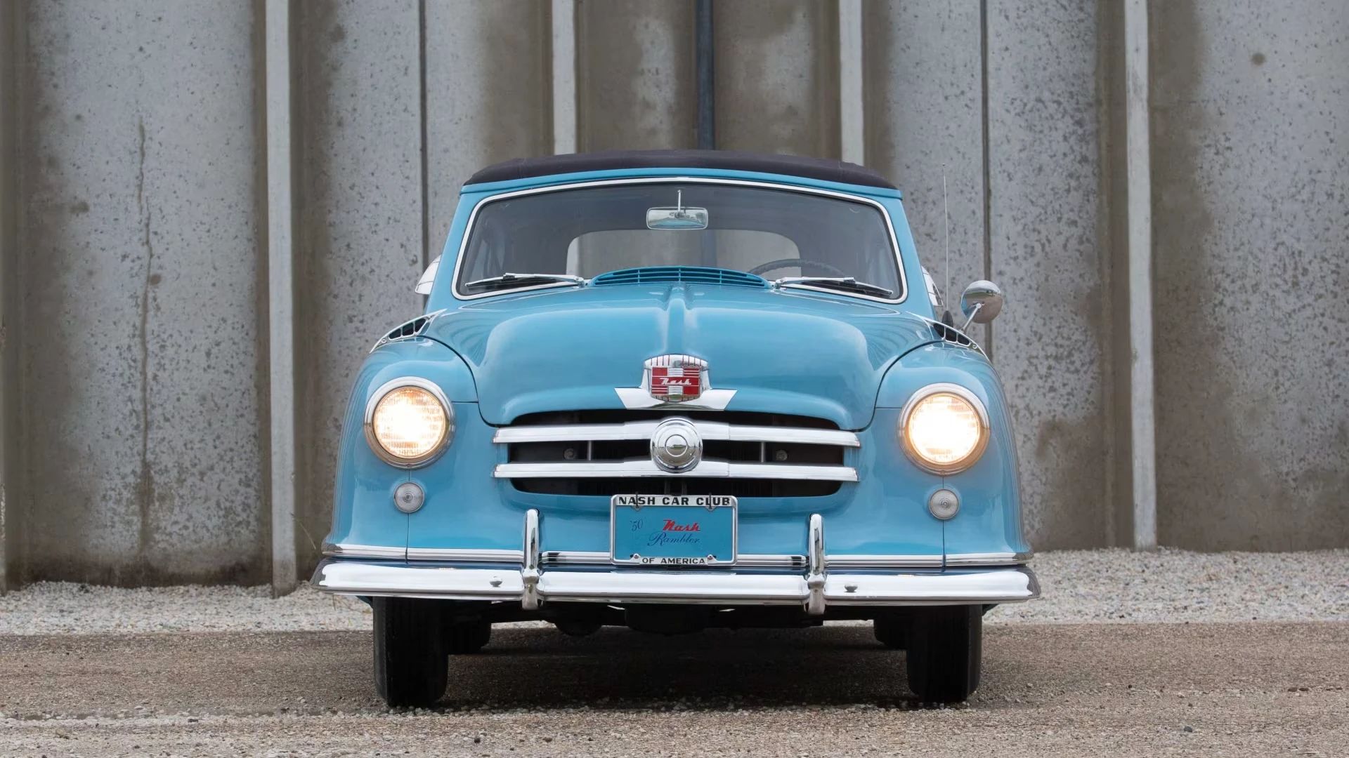 1950 Nash Rambler Convertible Landau: Adorable, Thrifty, But Not Cheap 34 Front view of a blue 1950 Nash Rambler Custom Convertible Landau with the top up and the headlights on