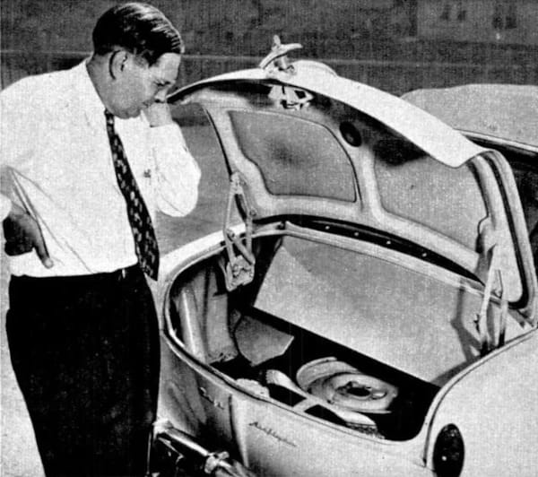 1950 Nash Rambler Custom Station Wagon – The Original Luxury Compact Turns 75 4 B&W photo showing a middle-aged white man in a shirt and tie contemplating the trunk of a 1950