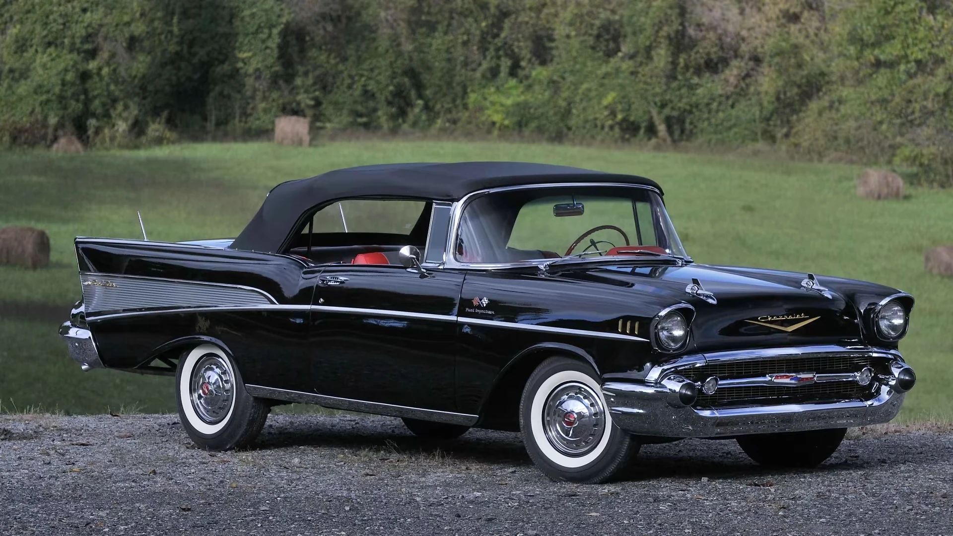 Right front 3q view of an Onyx Black 1957 Chevrolet Bel Air convertible with the top up
