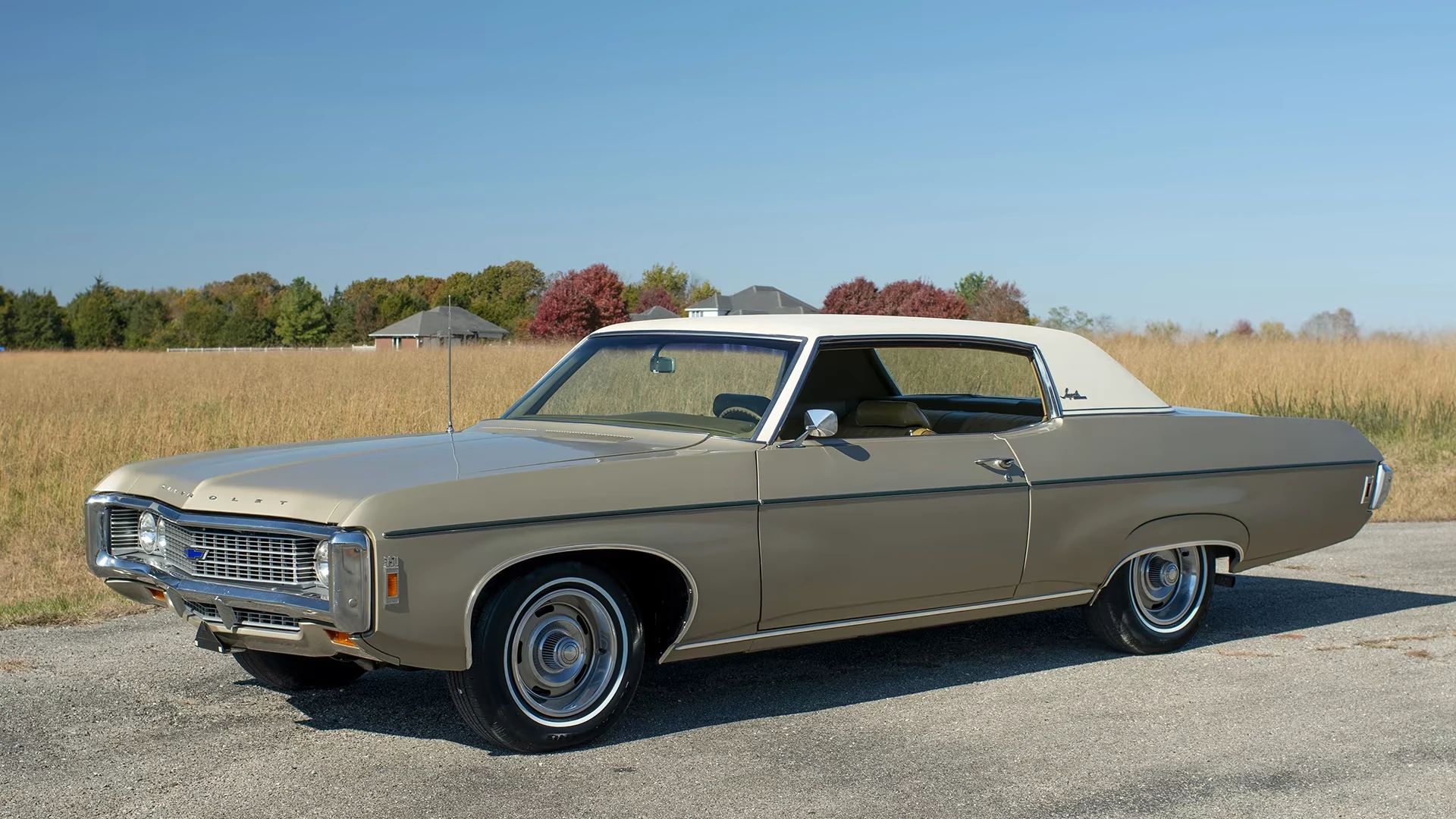 What Cars And Trucks Did Americans Buy In 1969? – A CC Auto Yearbook Feature 1 Left front 3q view of a gold 1969 Chevrolet Impala two-door hardtop with a white vinyl roof and 15-inch Rally wheels