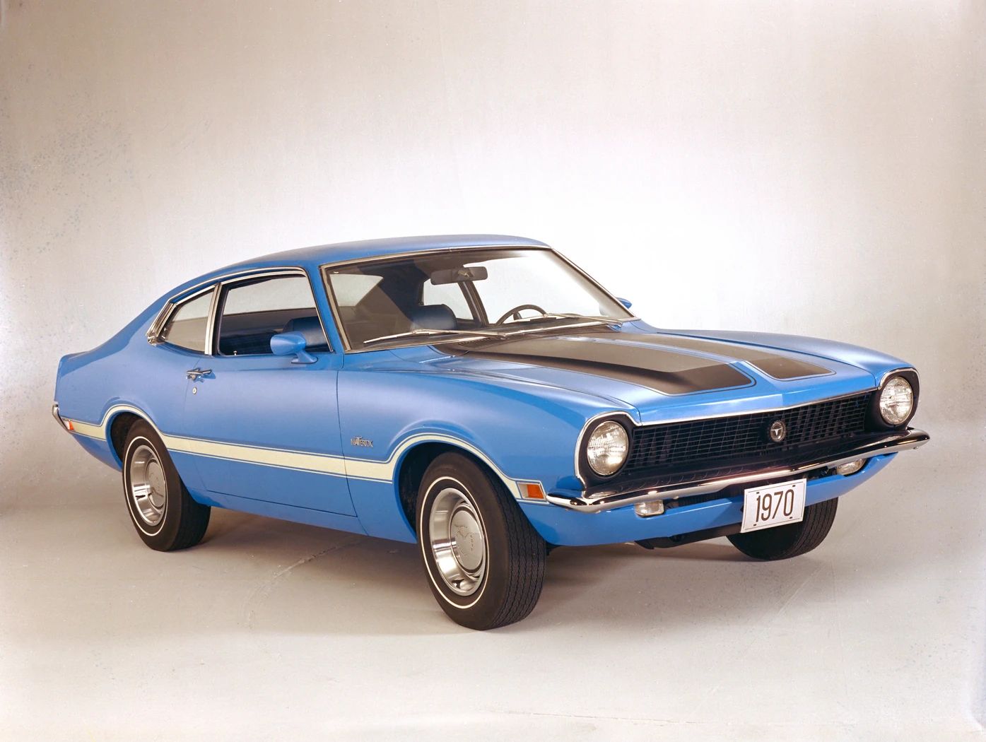 Studio shot of a blue 1970 Ford Maverick Grabber