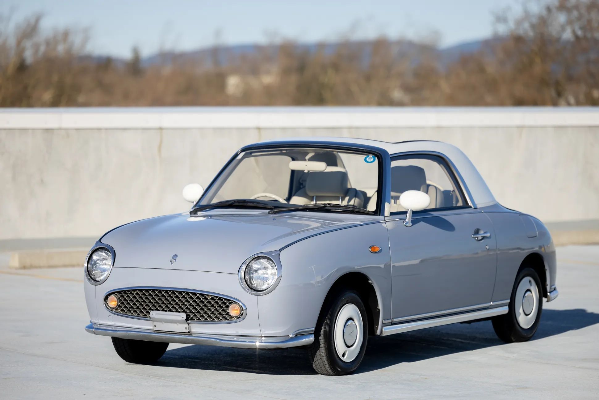 1950 Nash Rambler Convertible Landau: Adorable, Thrifty, But Not Cheap 32 Left front 3q view of a Lapis Grey 1991 Nissan Figaro with a white roof