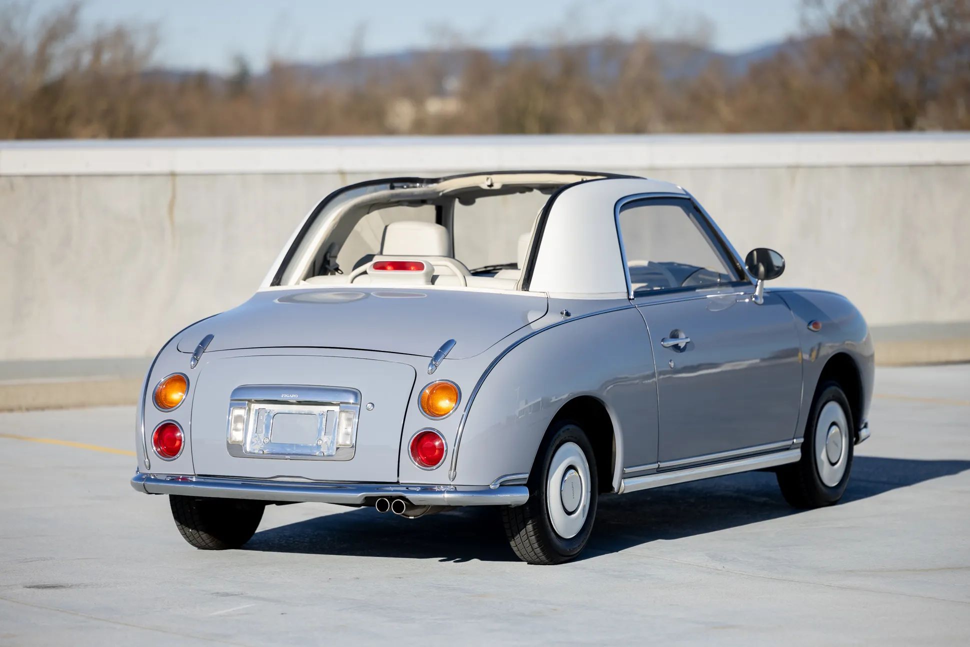 1950 Nash Rambler Convertible Landau: Adorable, Thrifty, But Not Cheap 33 Rear 3q view of a Lapis Grey 1991 Nissan Figaro with the top open