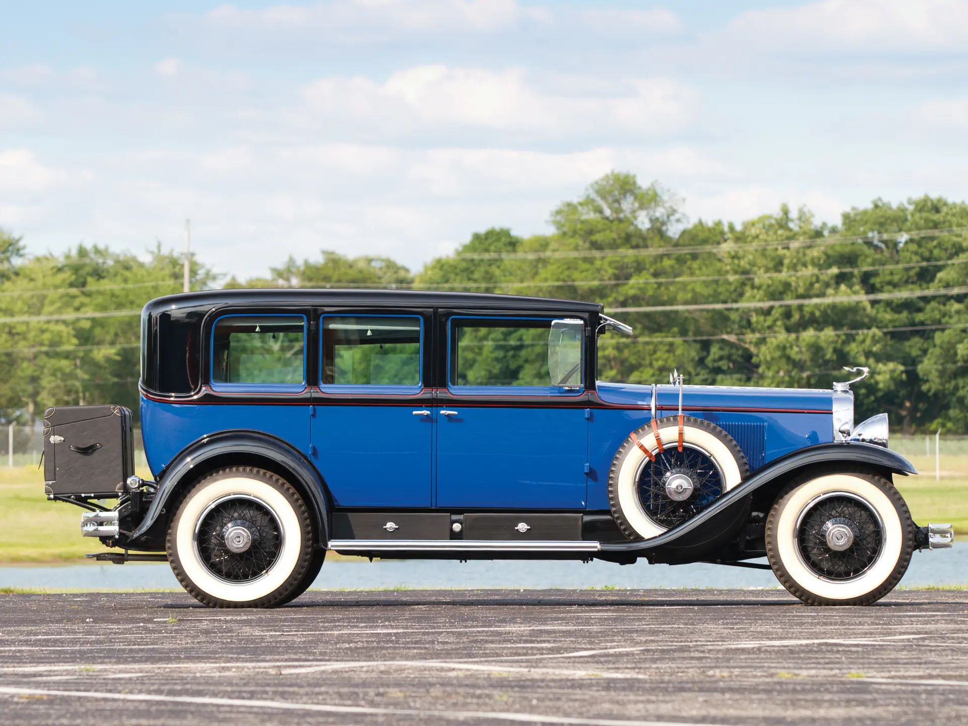 1929 Synchro-Mesh Transmission: How An Engineer From Oregon Took The Clash Out of Shifting Gears 20 Right side view of a Calumet Blue 1929 Cadillac formal sedan with a black roof and whitewall tires