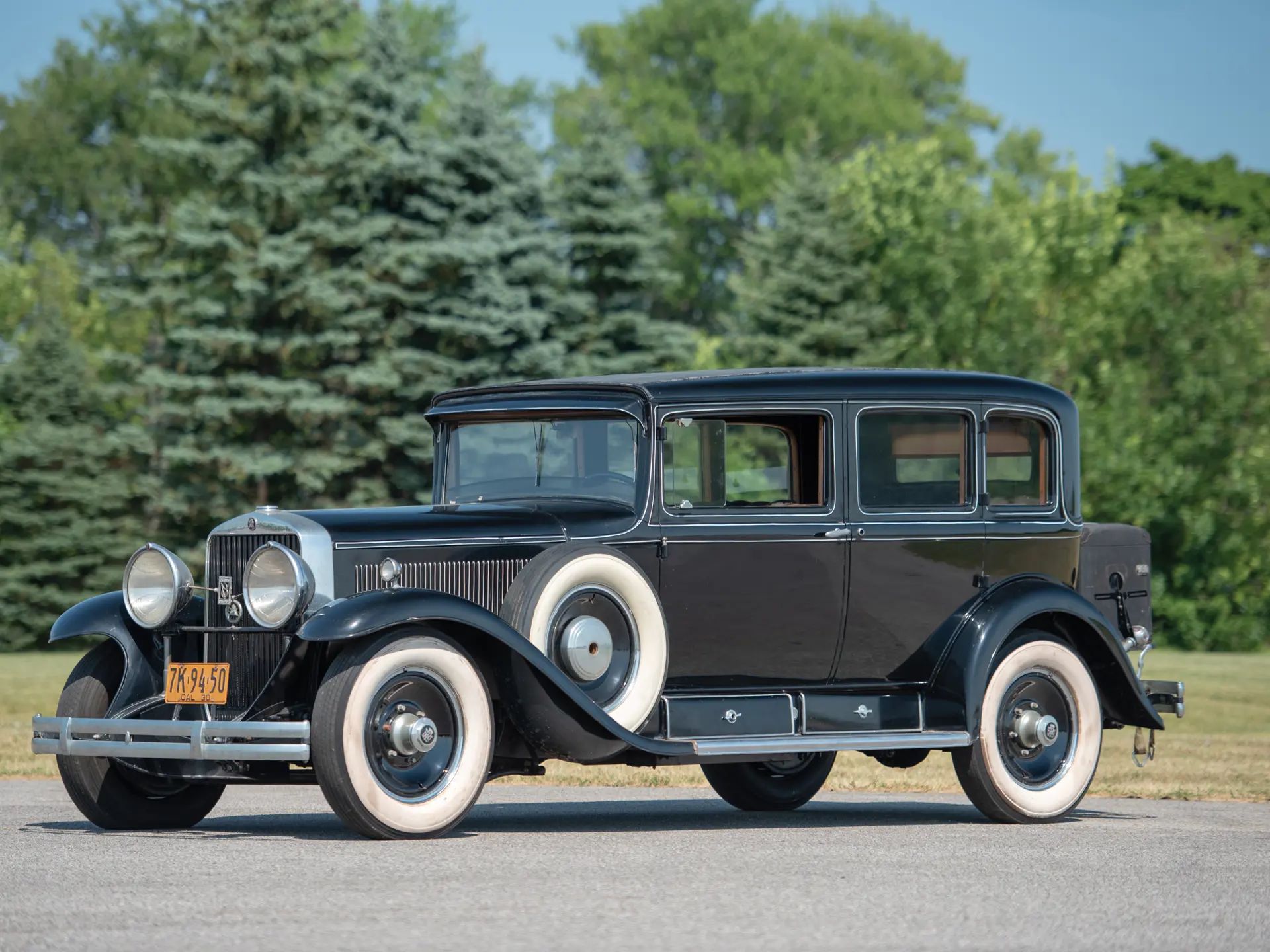 1929 Synchro-Mesh Transmission: How An Engineer From Oregon Took The Clash Out of Shifting Gears 13 Left front 3q view of a black 1929 Cadillac five-passenger sedan with white pinstripes and whitewall tires
