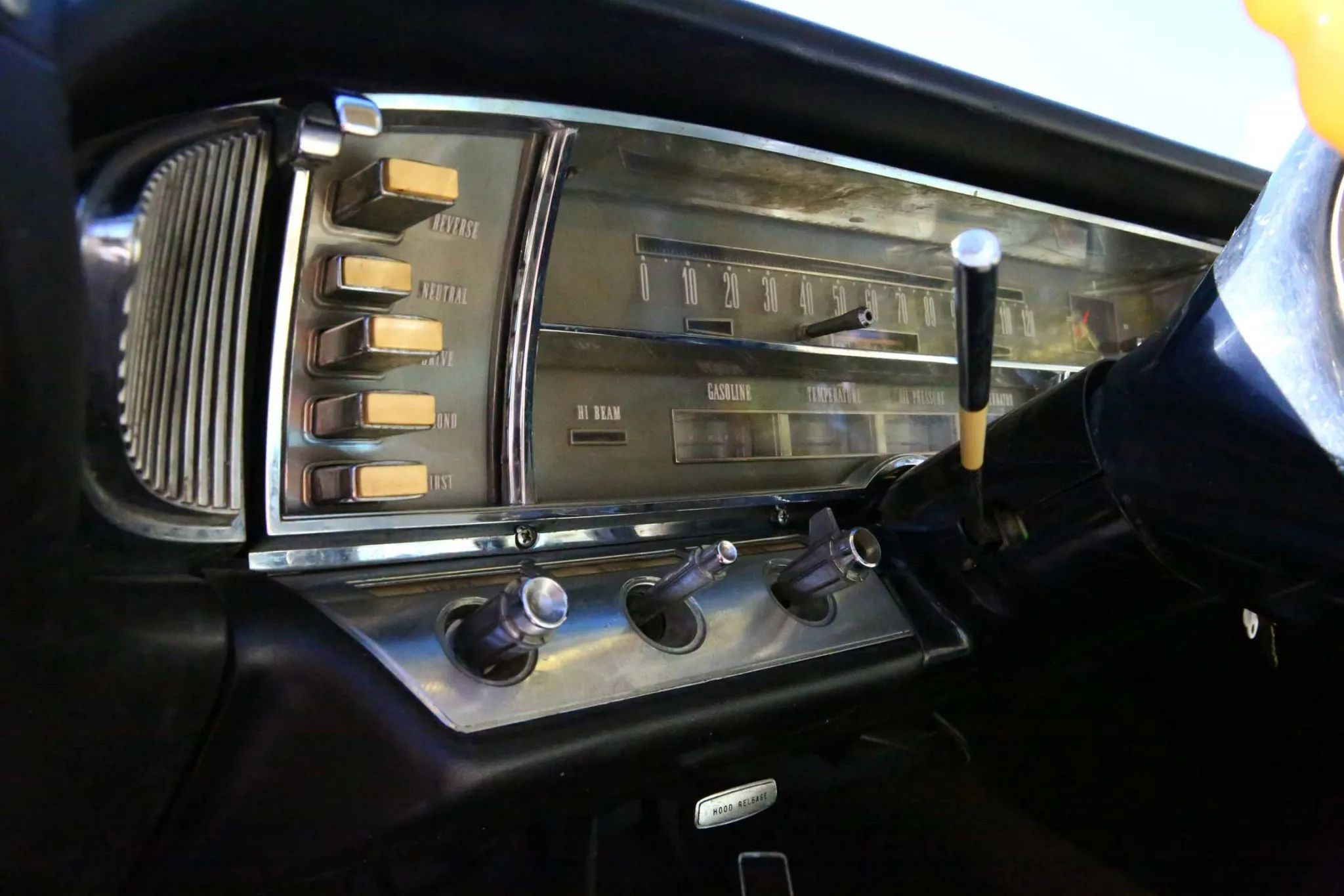 Pushbutton transmission controls on the left side of the dashboard of a 1964 Imperial LeBaron