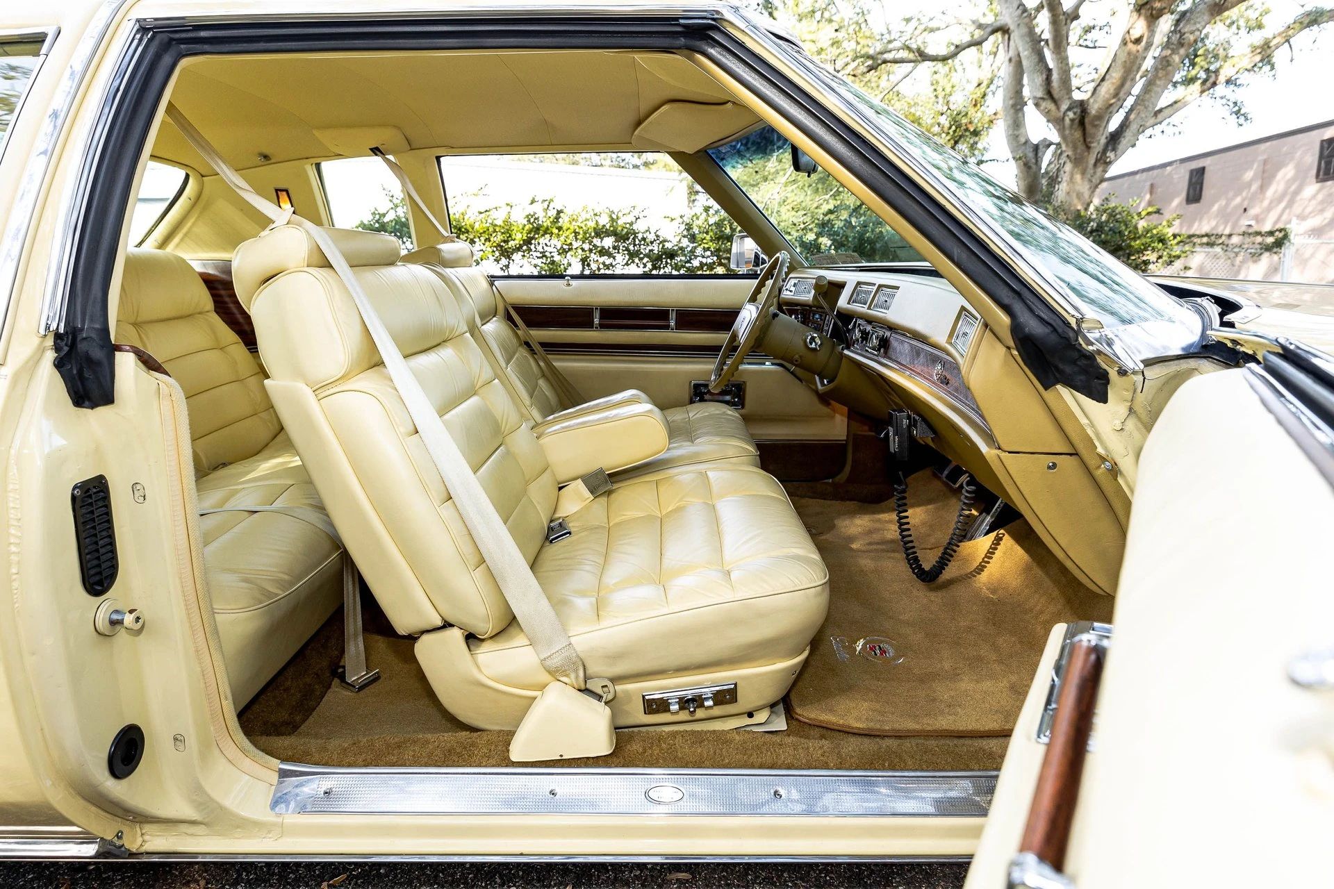 Front seat of a yellow 1978 Cadillac Eldorado with yellow leather upholstery