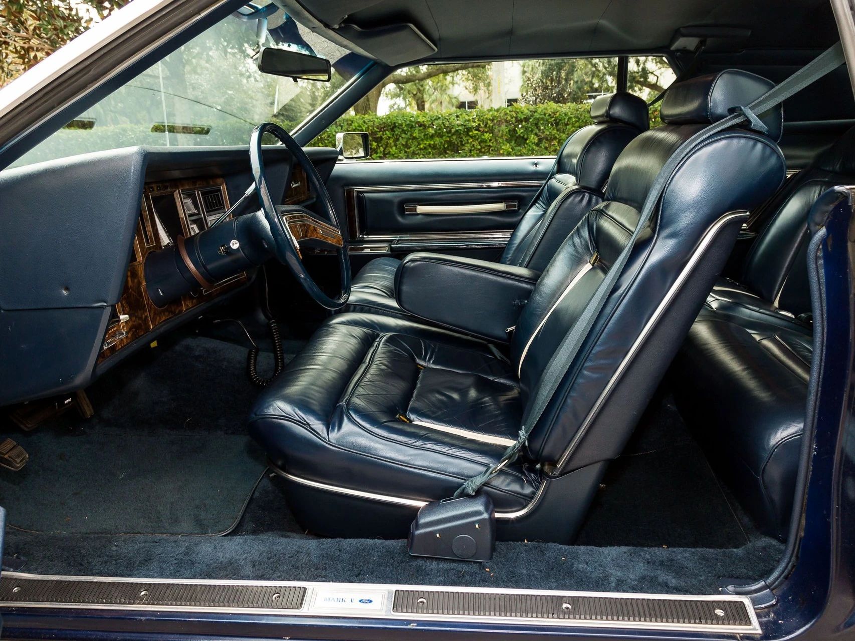 Front seat of a 1979 Lincoln Continental Mark V with dark blue leather