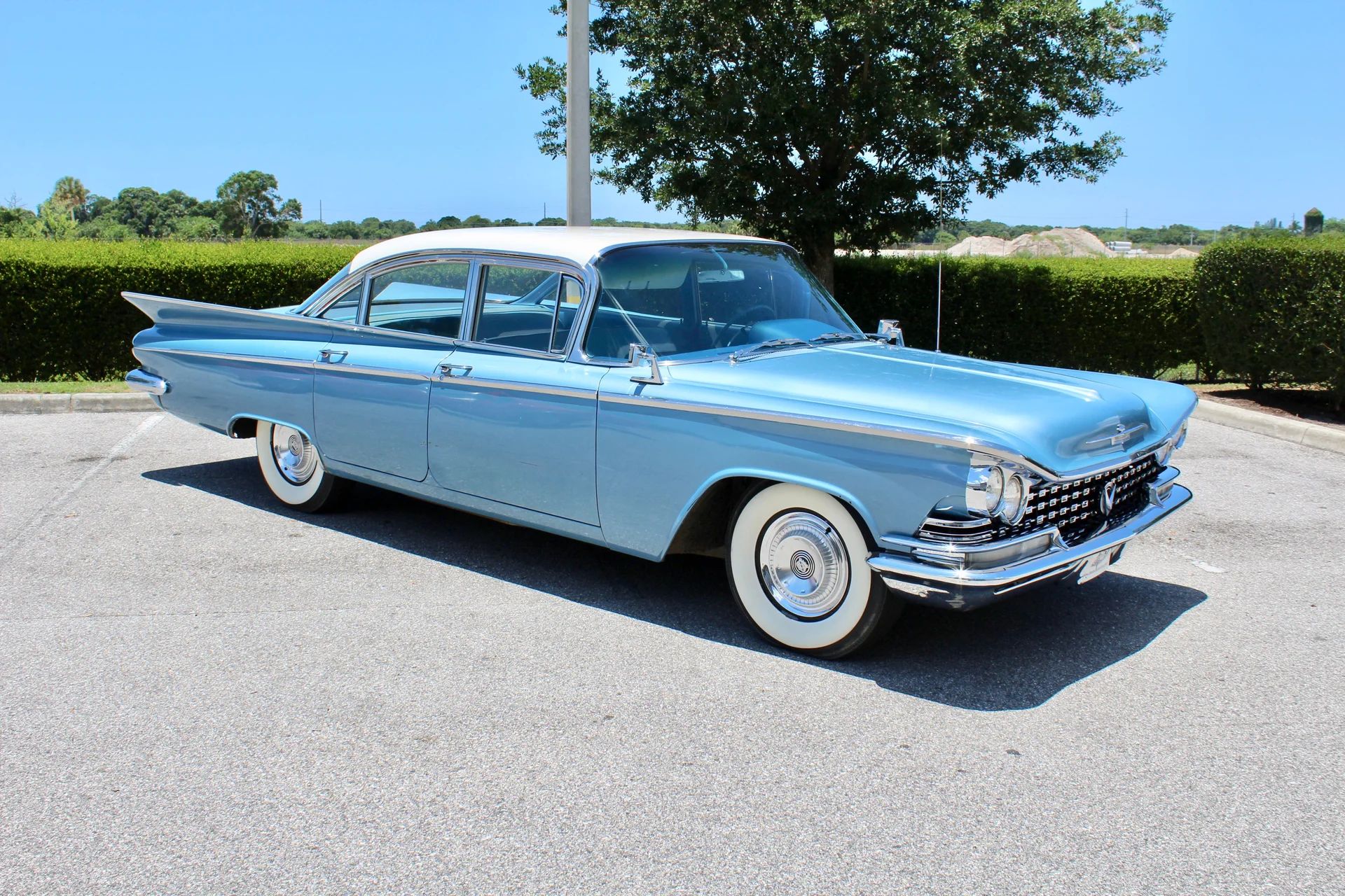 Full-Size Buicks Of The 1960s: How Buick Reinvented Its Lineup Between 1959 And 1970 5 Right front 3q view of a blue 1959 Buick LeSabre sedan with a white roof